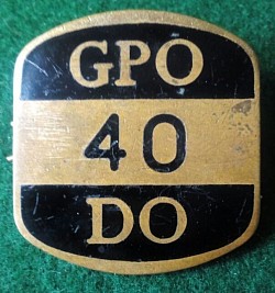 • Unique area coded, enameled badge.